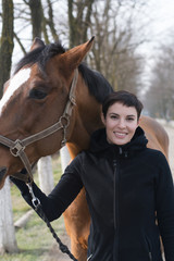 Smiling girl with horse