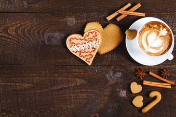 Christmas cookies and coffee on wooden table