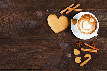 Christmas cookies and coffee on wooden table