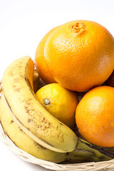Fruit basket isolated on white background