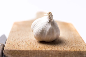 Garlic on wood cutting board