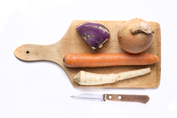 Vegetable soup ingredients on wood cutting board