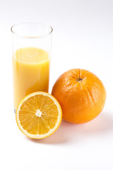 Fresh orange juice in glass with sliced orange