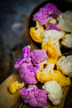 Colorful cauliflower on rustic background