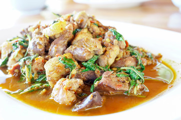 Stir fried chicken with curry paste and basil leaves