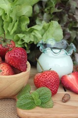 Fresh strawberries red and yogurt at delicious.