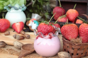 Fototapeta na wymiar Fresh strawberries red and yogurt at delicious.