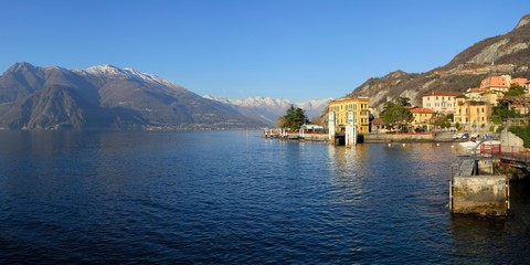 View of the lake and mountains above it. The small old resort town Varenna on the shore of the lake Como  in the Province of Sondrio in the Italian region Lombardy.