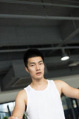 young man working out in modern gym