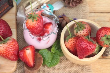 Fresh strawberries red and yogurt at delicious.
