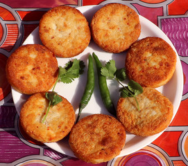Aloo Tikki or Fried Potato Patties; a popular Indian snack served with tomato and chilli sauce.
