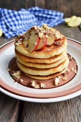Pancake with apples and nuts, rustic style