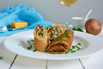 Delicate pancake stuffed with mushrooms and cheese