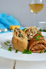 Delicate pancake stuffed with mushrooms and cheese