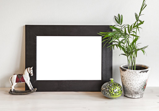 Frame mockup with toy horse