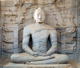 Fototapeta na wymiar Buddha statue carved in to the rock