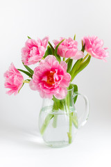 Naklejka na ściany i meble Pink tulips in a glass jar