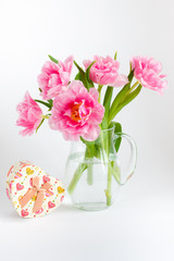 Pink tulips in a glass jar