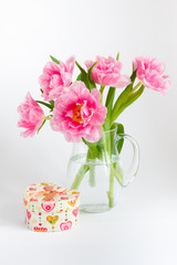 Pink tulips in a glass jar