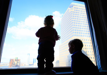 little boy and girl looking at skyscrapers in downtown New York