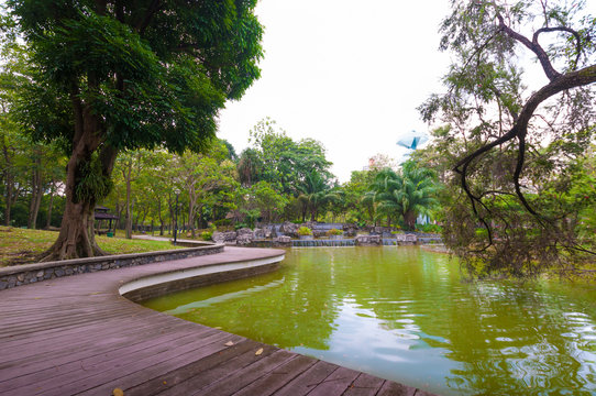 park pond with wooden walkway