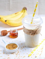 Obraz na płótnie Canvas Banana smoothie with honey and flax seed