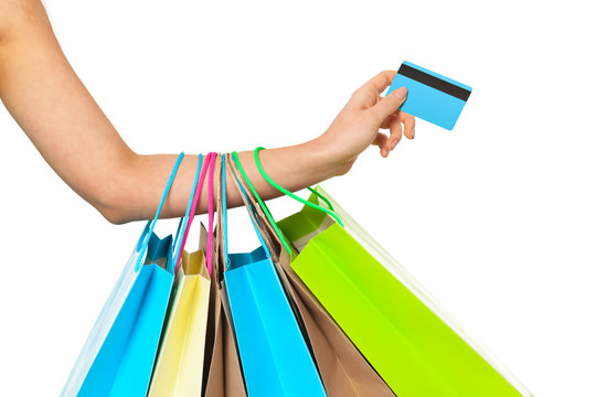 Closeup Of Womans Hand With Shopping Bags And Credit Card.