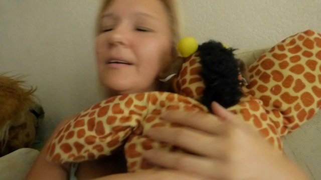Woman hugging a soft toy
