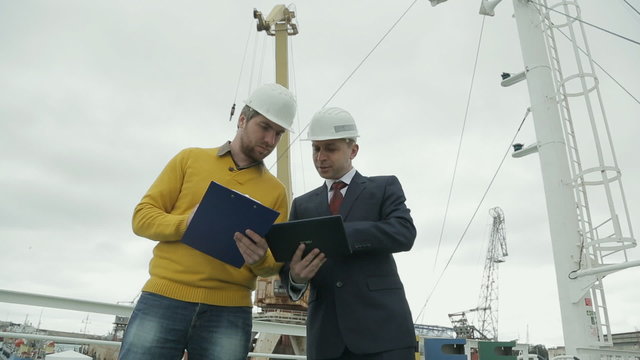 Meeting of business partners and co-operation in maritime factory