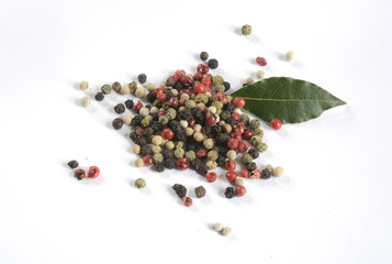 mixture of peppers hot pepper, red pepper, black pepper, white pepper, green pepper, background