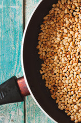 Roasted pine nuts in frying pan