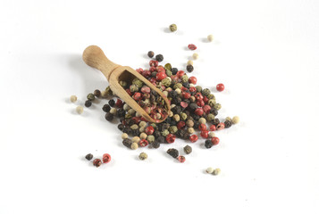 mixture of peppers hot pepper, red pepper, black pepper, white pepper, green pepper, background