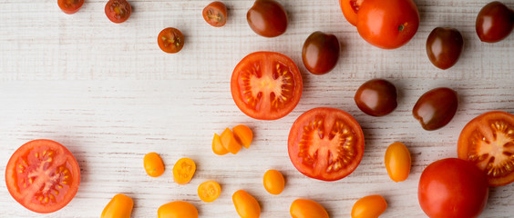 Tomatoes mix on the white table wide screen