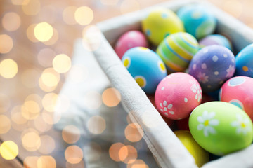 Fototapeta na wymiar close up of colored easter eggs in basket