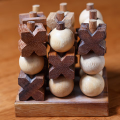 tic-tac-toe or noughts and crosses game  in wooden stick standing