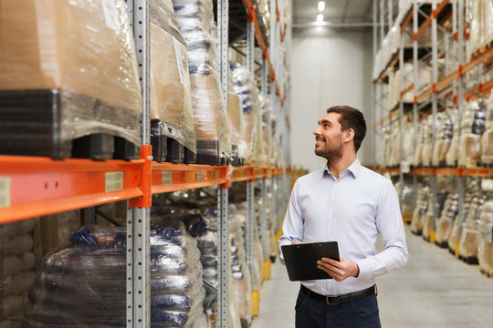 businessman with clipboard at warehouse