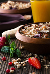 Healthy breakfast of muesli with strawberries, berries, juice an