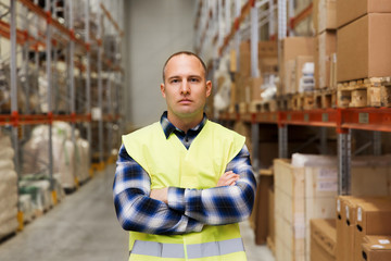 man in reflective safety vest at warehouse