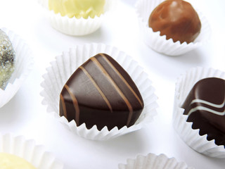 Chocolates, isolated on white. Chocolate truffles, arrangement.      