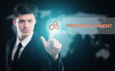 businessman pressing button on virtual screens