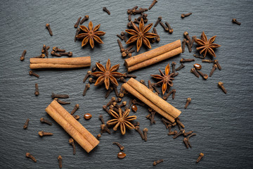 Cinnamon sticks, anise on a stone plate