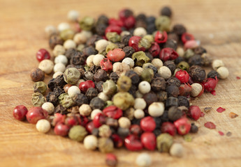 Various seasonings on wooden background