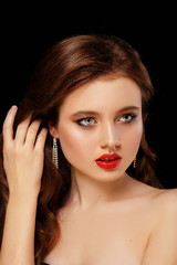 Fototapeta na wymiar Beautiful sexy girl with red lips and clean skin. Redhead model