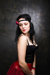 Fototapeta premium Portrait of woman wearing beautiful long red skirt and corset