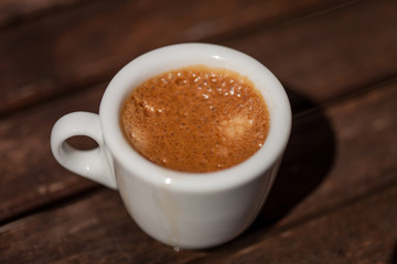 Cup of coffee on a wooden table