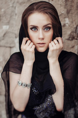 beautiful woman in a black headscarf