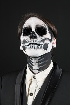 Evil day of the dead fancy dress man close up eyes closed