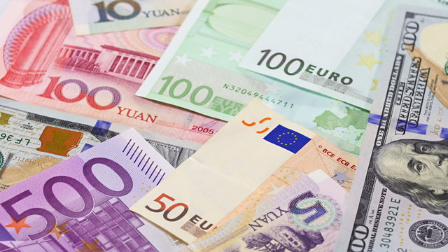 Main word currency Yuan, US Dollar and Euro bank notes rotating concept business background, loop ready