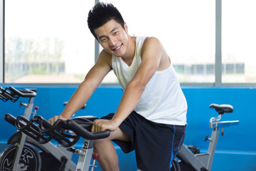 Fototapeta premium young man working out in modern gym