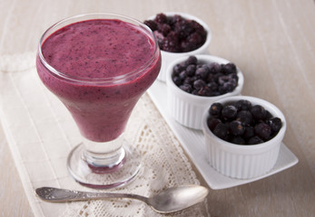 Fototapeta na wymiar Cocktail of frozen blackberries , blueberries and black curran